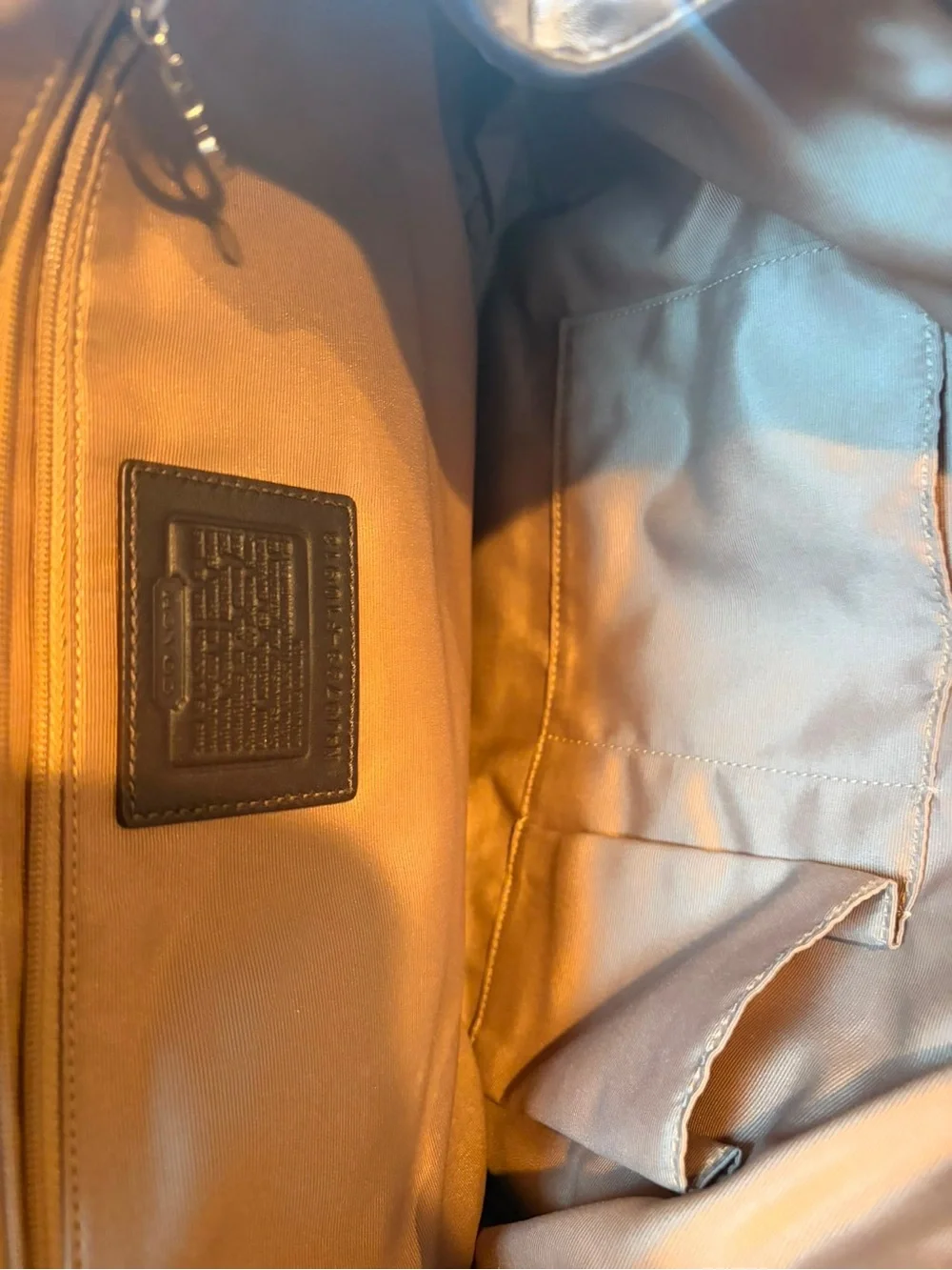 Coach Dark Brown Leather Buckle Satchel with Contrast Stitching.